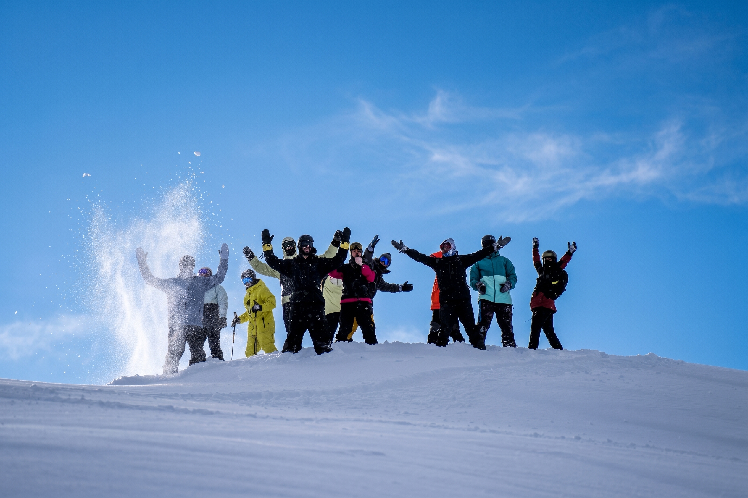 A shop crew celebrating on the mountain